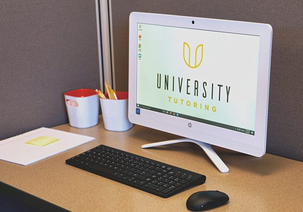 Photo of a computer with the University Tutoring logo